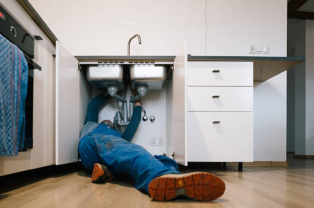 Professional Plumbing technician working in Roland, OK